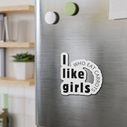 One Direction inspired fridge magnet on a stainless steel refrigerator featuring the Louis Tomlinson quote “I like girls who eat carrots” in bold black lettering.