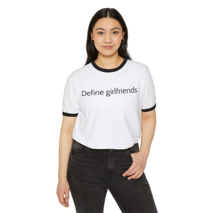 Woman wearing a white One Direction inspired ringer t-shirt with the Zayn and Louis era quote “Define girlfriends” across the chest.