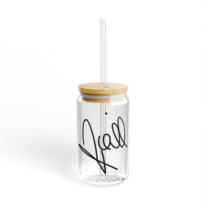 Clear glass sipper cup with bamboo lid and straw featuring Niall Horan’s replicated signature in bold black across the front.