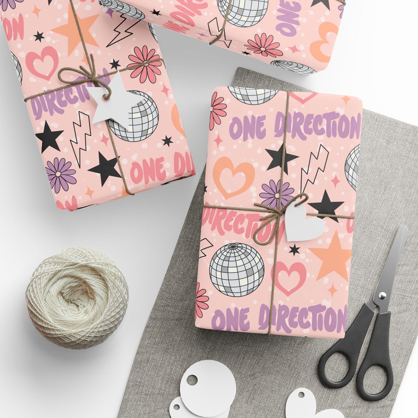 Fan-made One Direction inspired pastel gift wrap featuring disco balls, hearts, stars, flowers, and lightning bolts, created for adult Directioners.