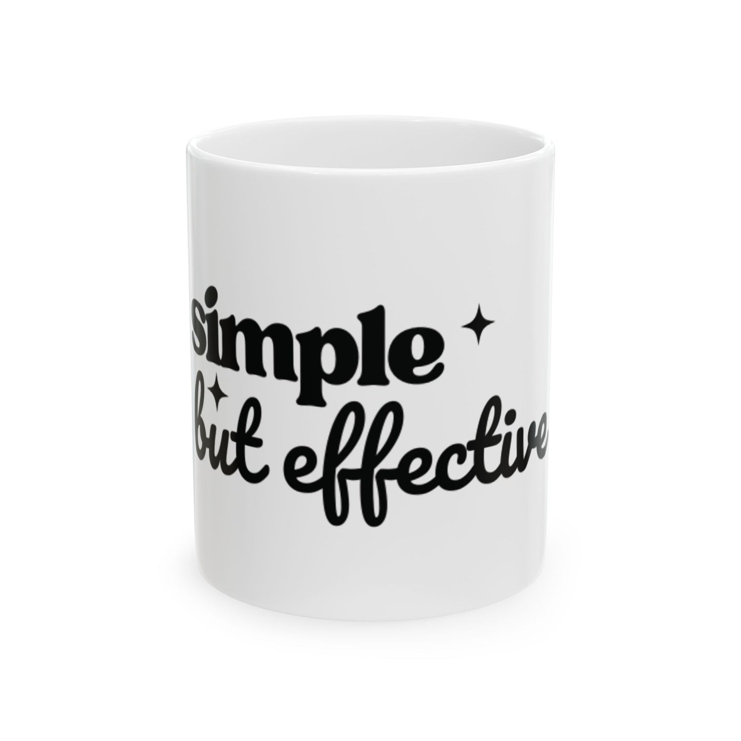 White ceramic One Direction inspired mug with the Harry Styles quote “simple but effective” printed in black text.