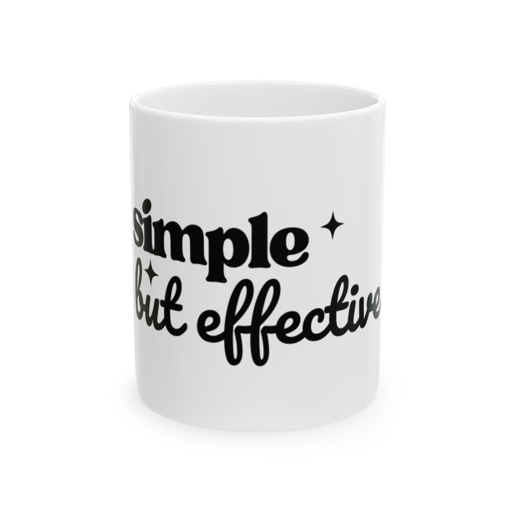 White ceramic One Direction inspired mug with the Harry Styles quote “simple but effective” printed in black text.